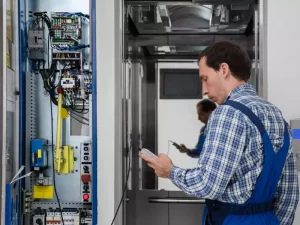 Engineers are renovating the elevator control cabinet