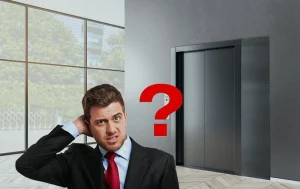 Man thinking in front of the elevator