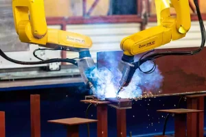 Metal welding equipment welding robot arm in elevator factory