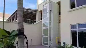 Comparison of outdoor residential elevators for single-family homes vs. townhouses, showing hydraulic, traction, and MRL elevator placements.