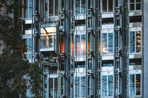 This picture shows 4 different types of elevators running side by side.
