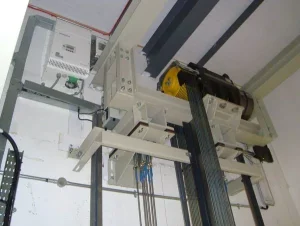 Photos of the machine room of the machine roomless freight elevator