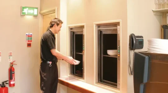 Service elevator in a hotel, used for transporting kitchen equipment, food, and other heavy items efficiently between floors